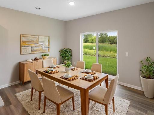 Dining Room, Virtually Staged. Photo taken of another home with similar plan and finishes. Photos and renderings may not depict actual plan, materials, & finishes may vary. All measurements are approximate.