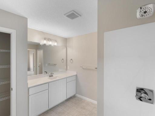 Private Primary Bathroom. Photo taken of another home with similar plan and finishes. Photos and renderings may not depict actual plan, materials, & finishes may vary. All measurements are approximate.