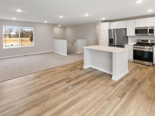 Open Layout. Photo is taken of another home with similar plan and finishes.