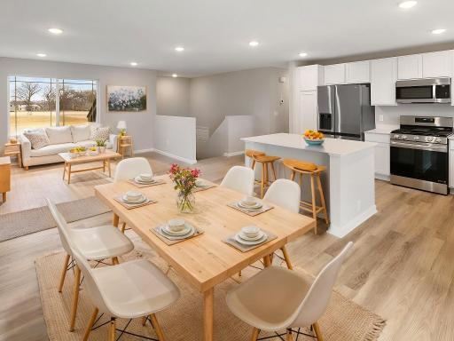 Open Layout, Virtually Staged. Photo is taken of another home with similar plan and finishes.