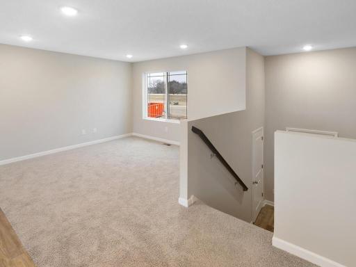 Living Room. Photo is taken of another home with similar plan and finishes.
