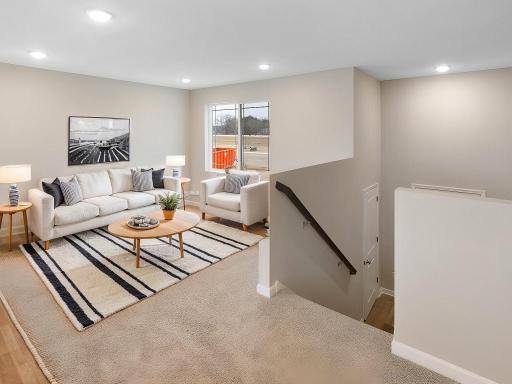 Living Room, Virtually Staged. Photo is taken of another home with similar plan and finishes.