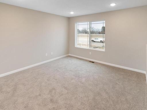 Living Room. Photo is taken of another home with similar plan and finishes.