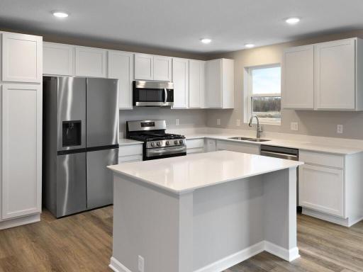 Kitchen. Photo is taken of another home with similar plan and finishes.