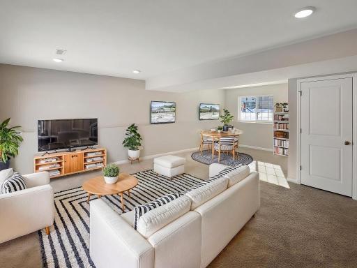 Lower Level Finished Family Room, Virtually Staged. Photo is taken of another home with similar plan and finishes.