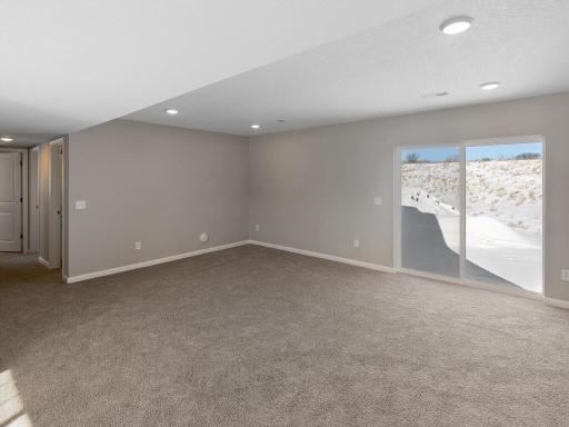 Lower Level Finished Family Room. Photo is taken of another home with similar plan and finishes.