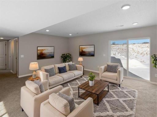 Lower Level Finished Family Room, Virtually Staged. Photo is taken of another home with similar plan and finishes.