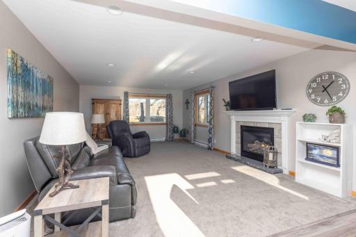 Spacious living room with newer carpet.