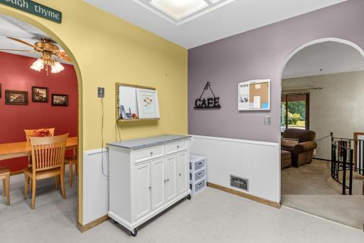 The kitchen feautres arched doorways leading to the living room and dining room.