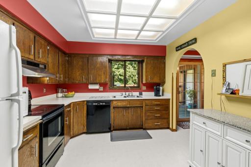 The kitchen window overlooks the backyard.