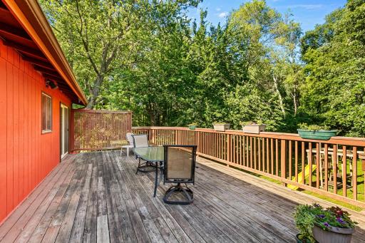 Access the large deck through the dining room, addition and the primary bedroom.