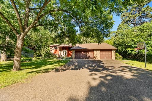 This home feautres a three car garage with lots of parking space on the spacious driveway.