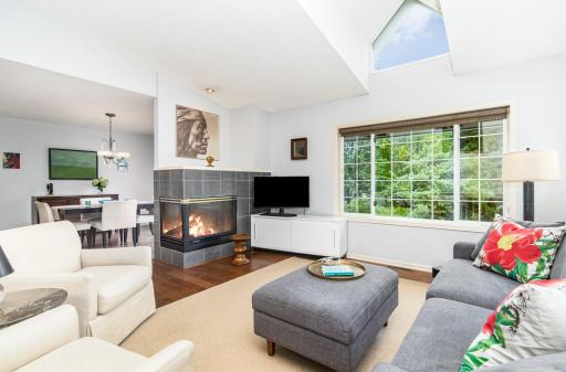 You will love the spacious living space with the vaulted ceiling, the abundance of nature light, and the ambiance provided by a wonderful gas fireplace !