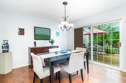 Spacious dining room with patio doors to a generous deck for entertaining friends and family!