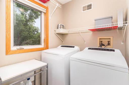 Upper Bedroom level laundry room is conveniently located adjoining the two upper floor bedrooms.