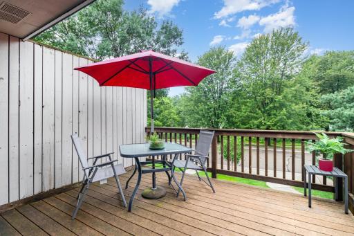 The spacious deck is perfectly sized for entertainment and post-work relaxation. This end-unit overlooks an attractive pollinator garden directly across the driveway.