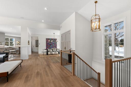 Solid white oak flooring - view into the dining and entrance to lower level.