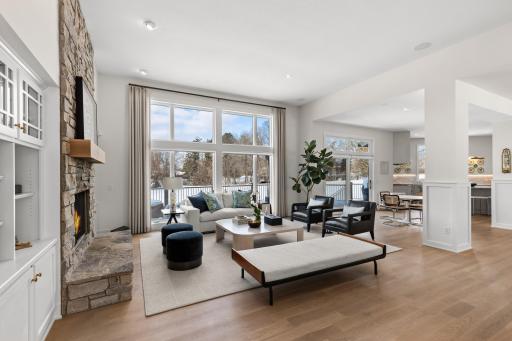 First floor living room with western views. Custom motorized window treatments for every season.