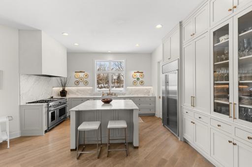 A modern open kitchen concept with built-in cabinetry and lovely natural light.