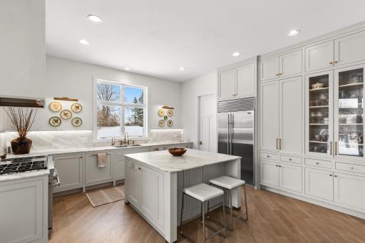 Custom cabinetry, Calacatta marble countertops and every storage detail thoughtfully designed.