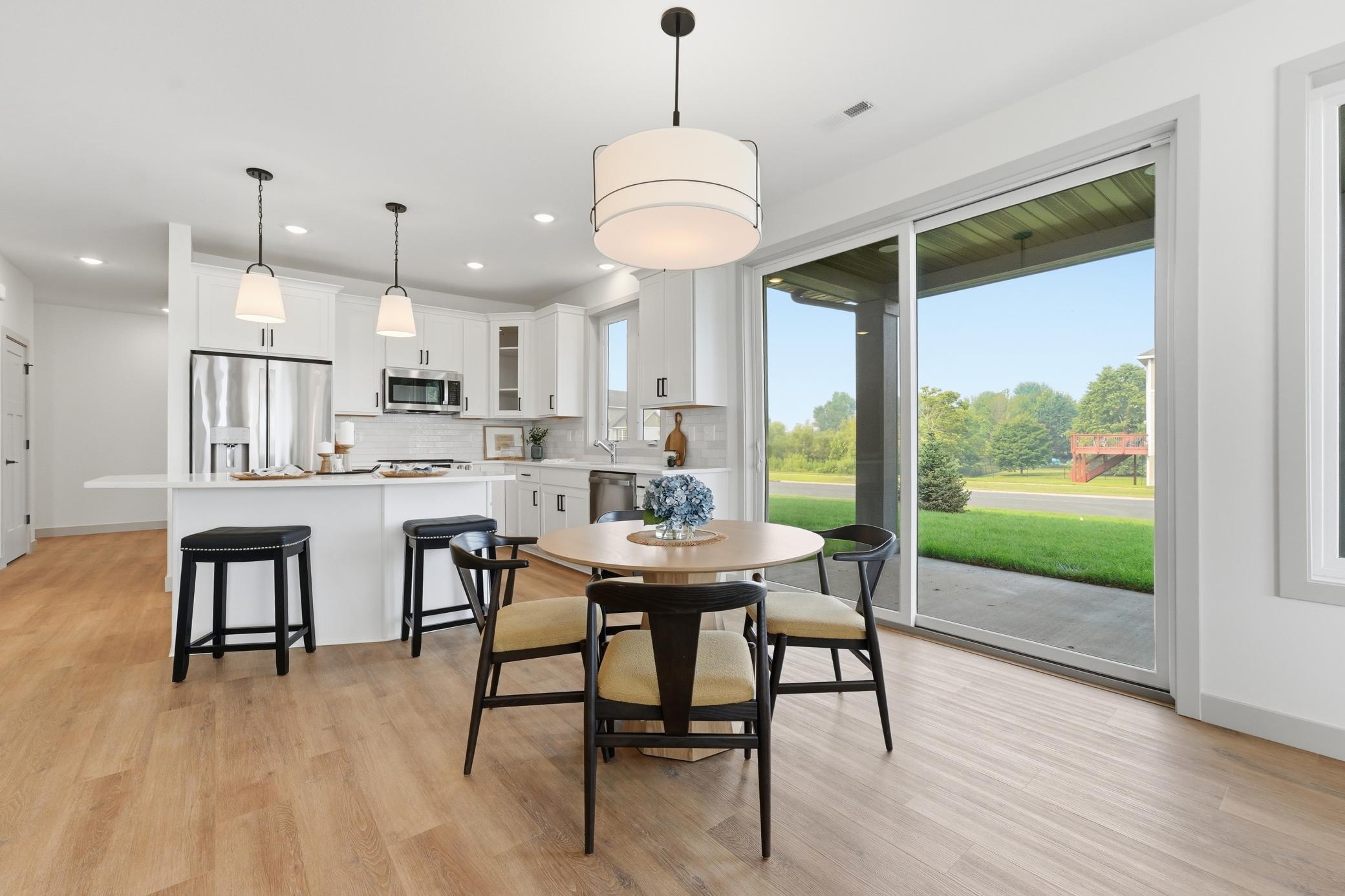 Oversized sliding doors lead to your covered patio