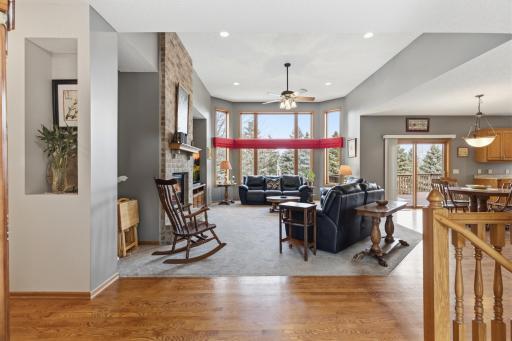 This is Quite an Entrance! Note the Recessed Lighting, Ceiling Fan and Carpeted Living Room.