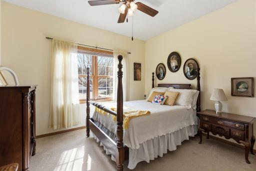 Main Level Bedroom 2 with Another Ceiling Fan, Lots of Closet Space, Large Windows with Grids Between the Glass and Southern Exposure.