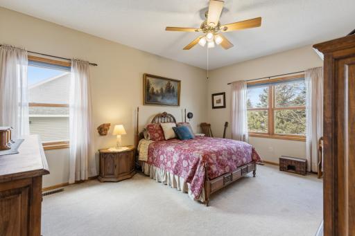 Enter the Main Level Owners Suite with a Ceiling Fan and Oversized Windows Facing North to the Back Yard and West. At 16 x 12 ft it's Fit for a King (or Queen) Bedroom Set!