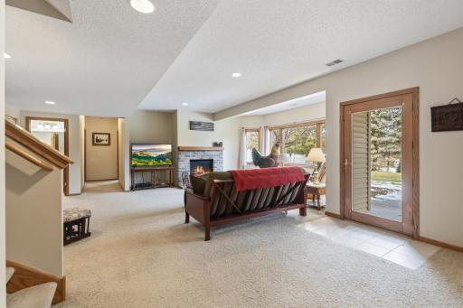 Now to the Lower Level Family Room, with a Walkout to the Back Yard Through the 23 x 17 ft Patio Area Shaded by the Deck.