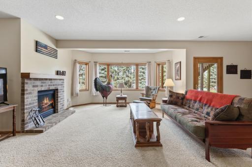 Notice the High Ceiling, Recessed Lighting, Gas Fireplace and of Course all of the Large Windows.