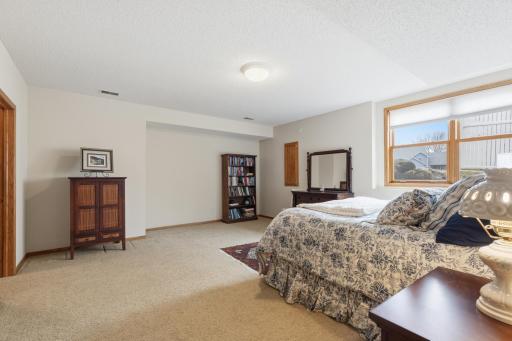 At 16 x 15 ft Lower Level Bedroom 5 is Actually Larger than the Main Level Owner's Suite, with Large West Facing Windows Looking out to Landscaping, not into an Egress Well.