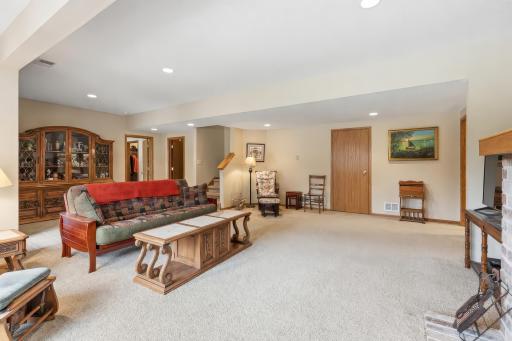 Another View of the Family Room, with Bedrooms 4 and 5 at Right, Access to the Storage and Furnace Room Straight Ahead and Bedroom 6 Past the Stairs at Left.
