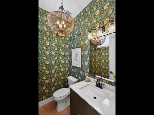 Main level Bath with amazing wall paper and lighting