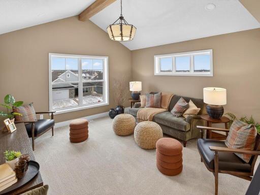 Upper-level loft providing flexible living or recreational space.
