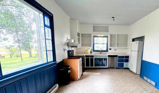 Kitchen is spacious, lots of room to make this the kitchen of your dreams