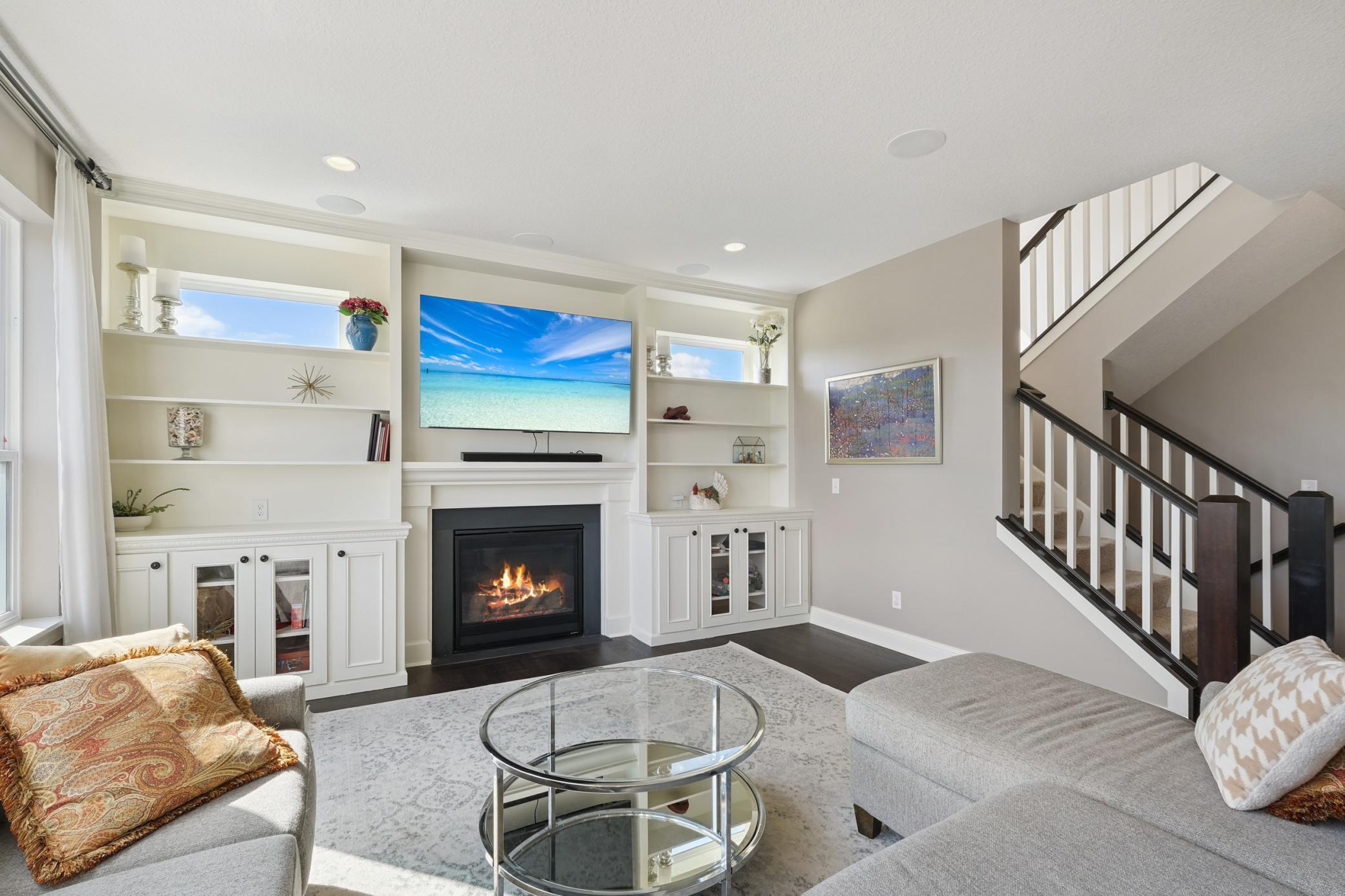 Living room with gas fireplace and built ins
