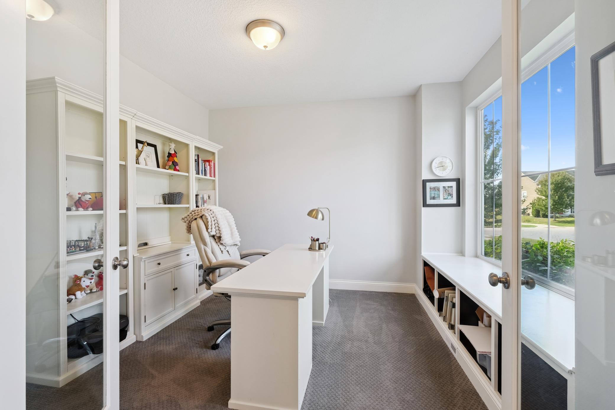 Main floor office with glass French doors