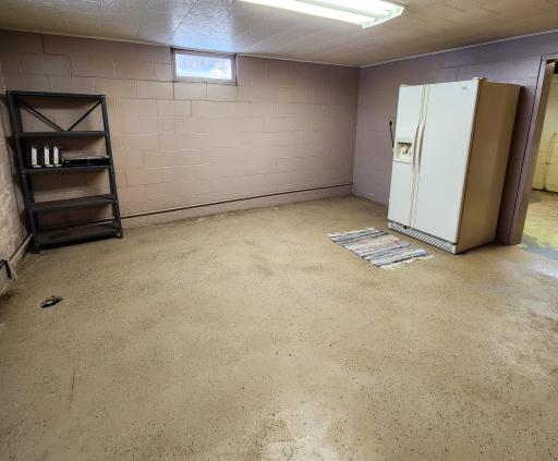 The bonus room in the basement is the perfect spot for an extra fridge, storage shelves or whatever you can imagine..jpg