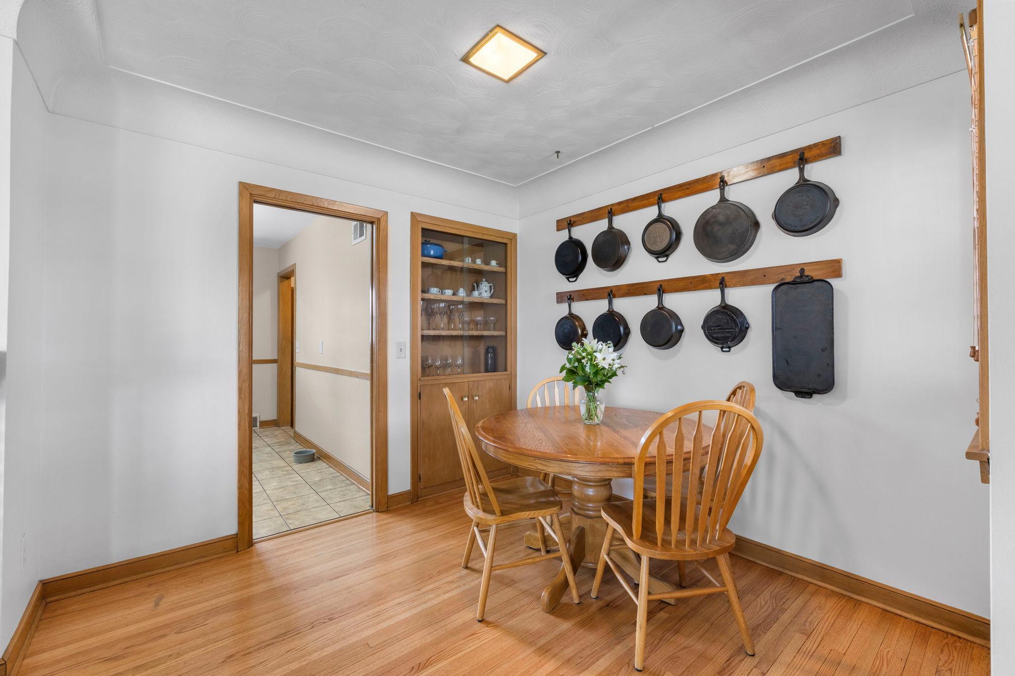 Dining Room with built-in alcove with shelving and cabinets.