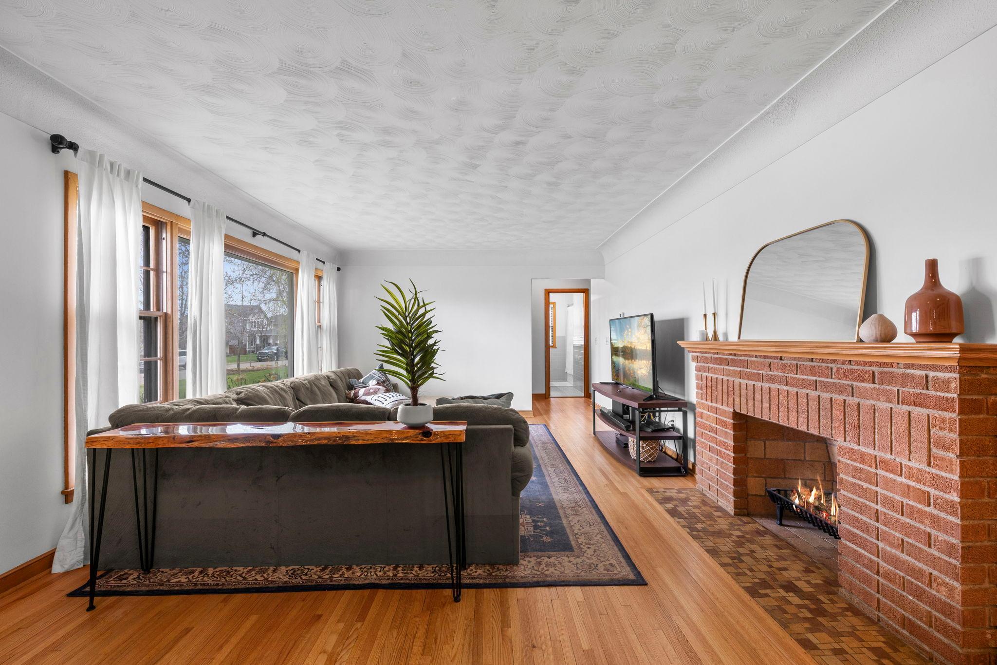 Brick decorative fireplace. *Note: Fireplace is currently capped.*