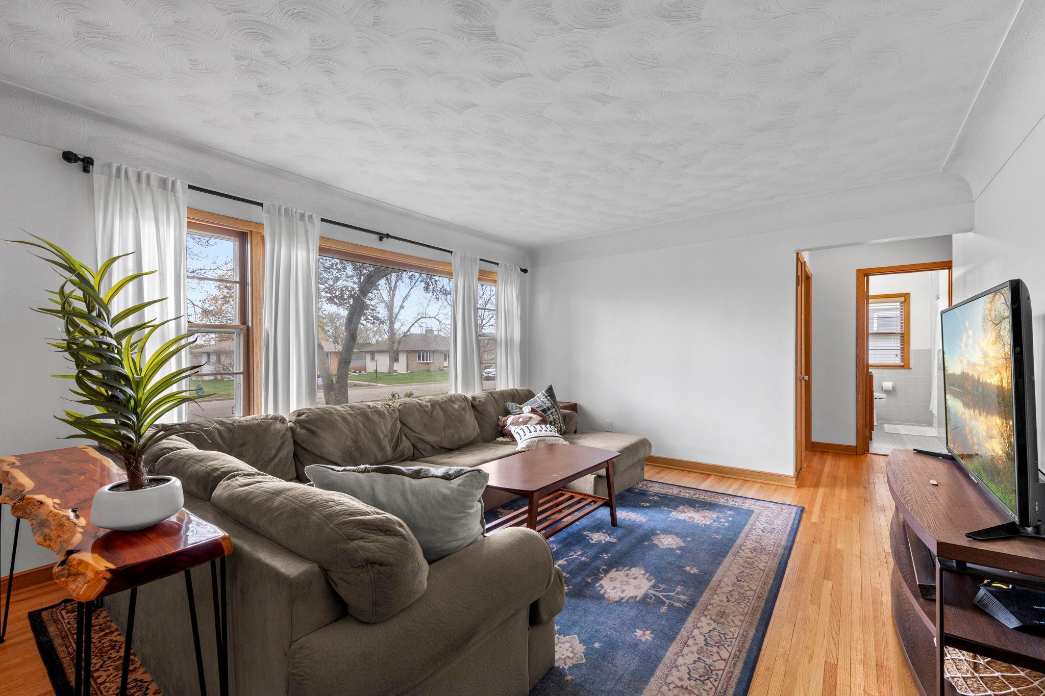 Large window brightens the living room.