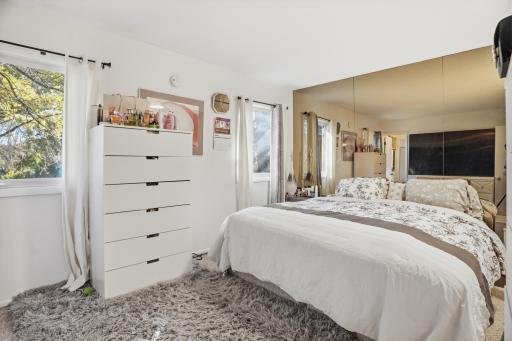 Primary bedroom with a private 3/4 bath