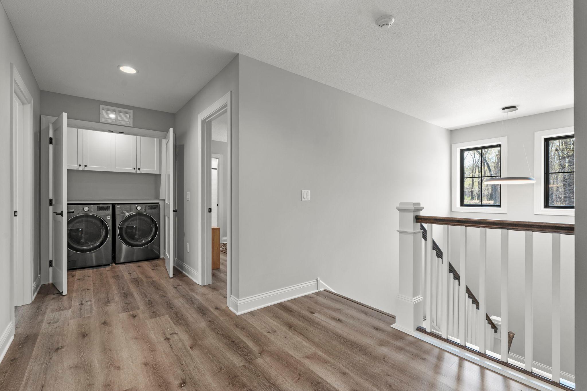 Upper level landing with laundry closet