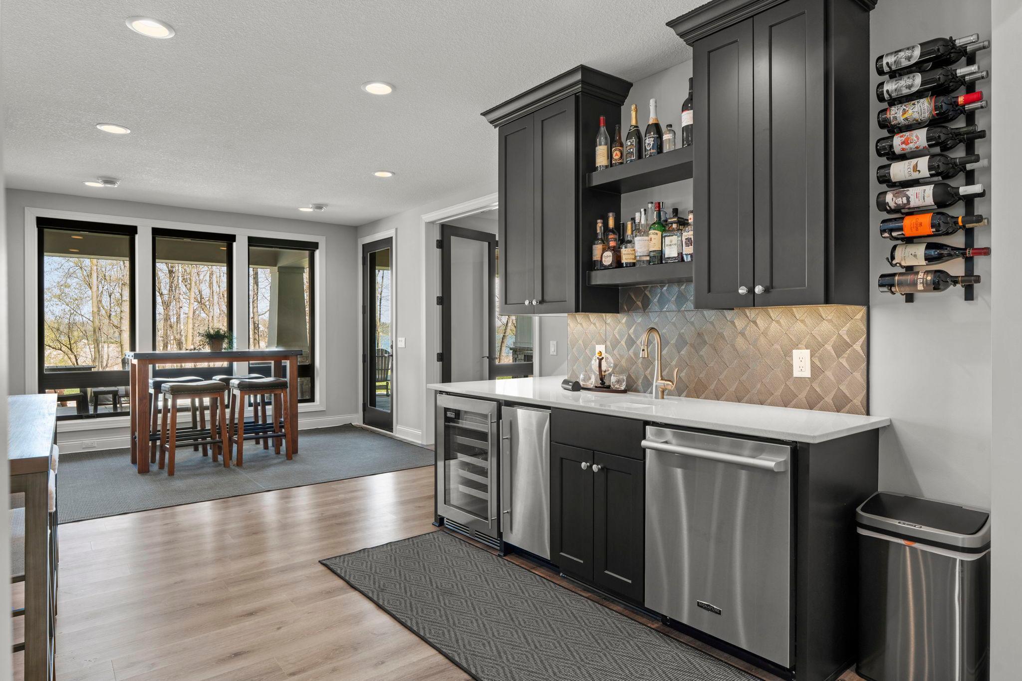 Wet bar, complete with mini fridge, wine cooler, ice maker and dishwasher