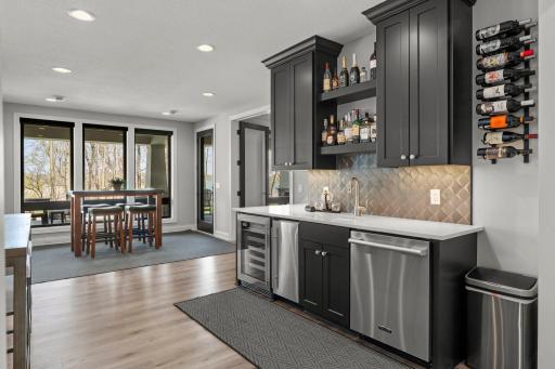 Wet bar, complete with mini fridge, wine cooler, ice maker and dishwasher