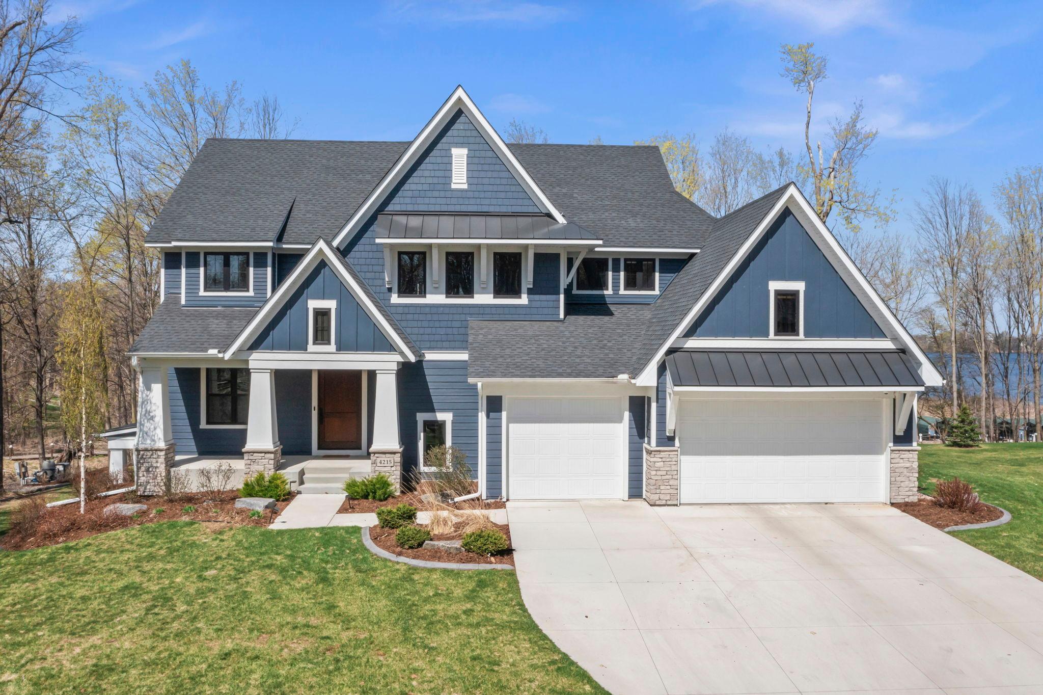 Concrete driveway, sprinkler system on an end-lot