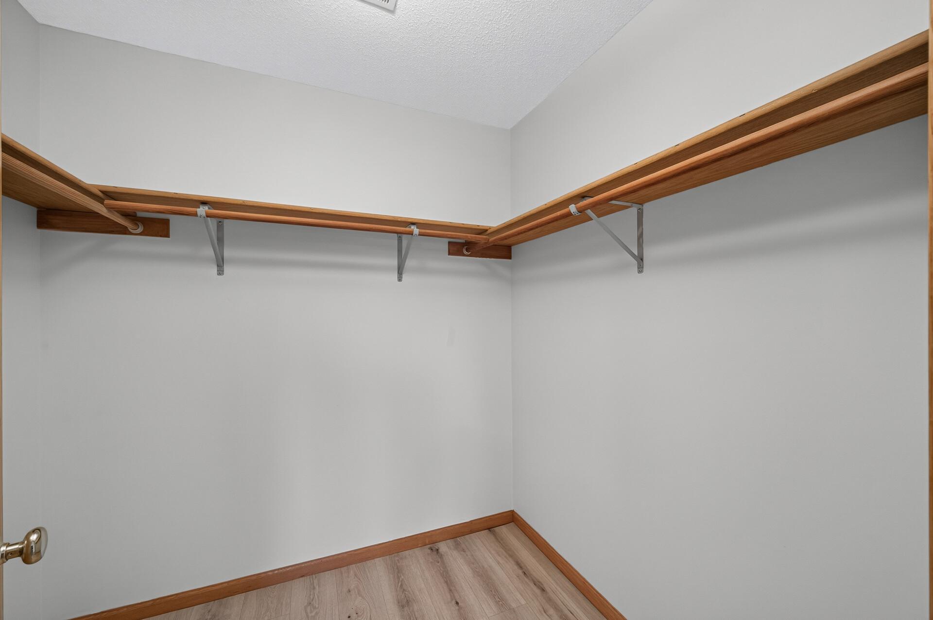 Primary bedroom's huge walk-in closet