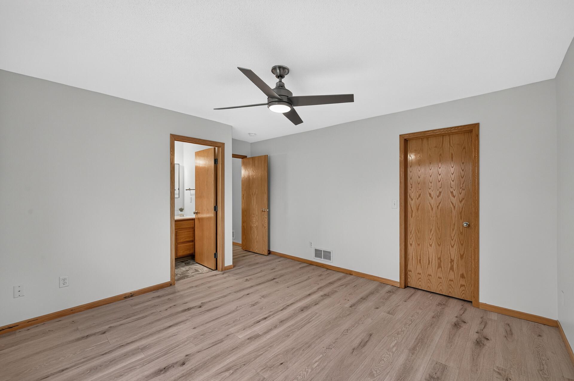 Primary bedroom- showing walk-in closet door