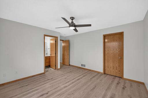 Primary bedroom- showing walk-in closet door