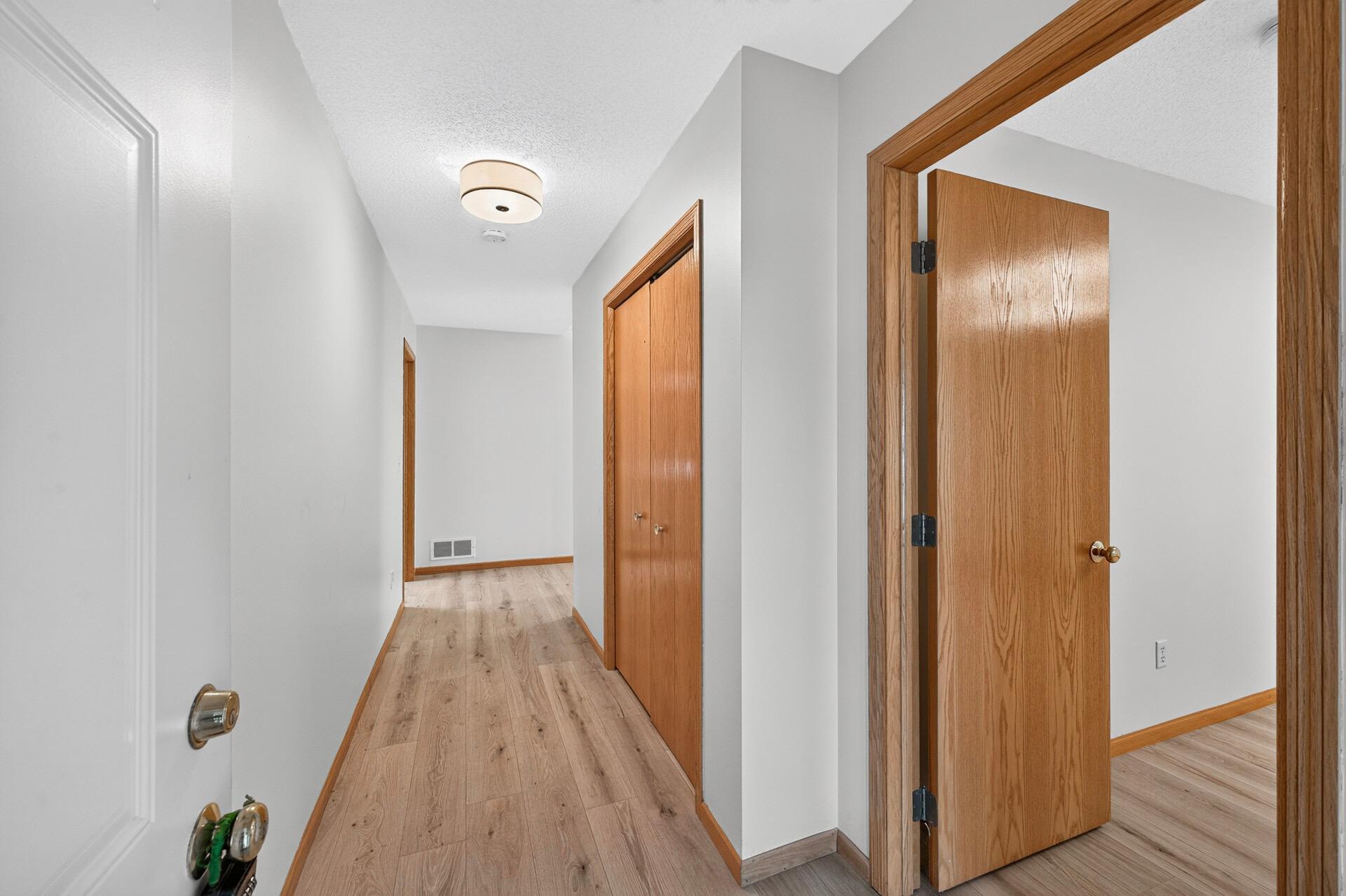 Entryway, entrance to front bedroom and hallway closet